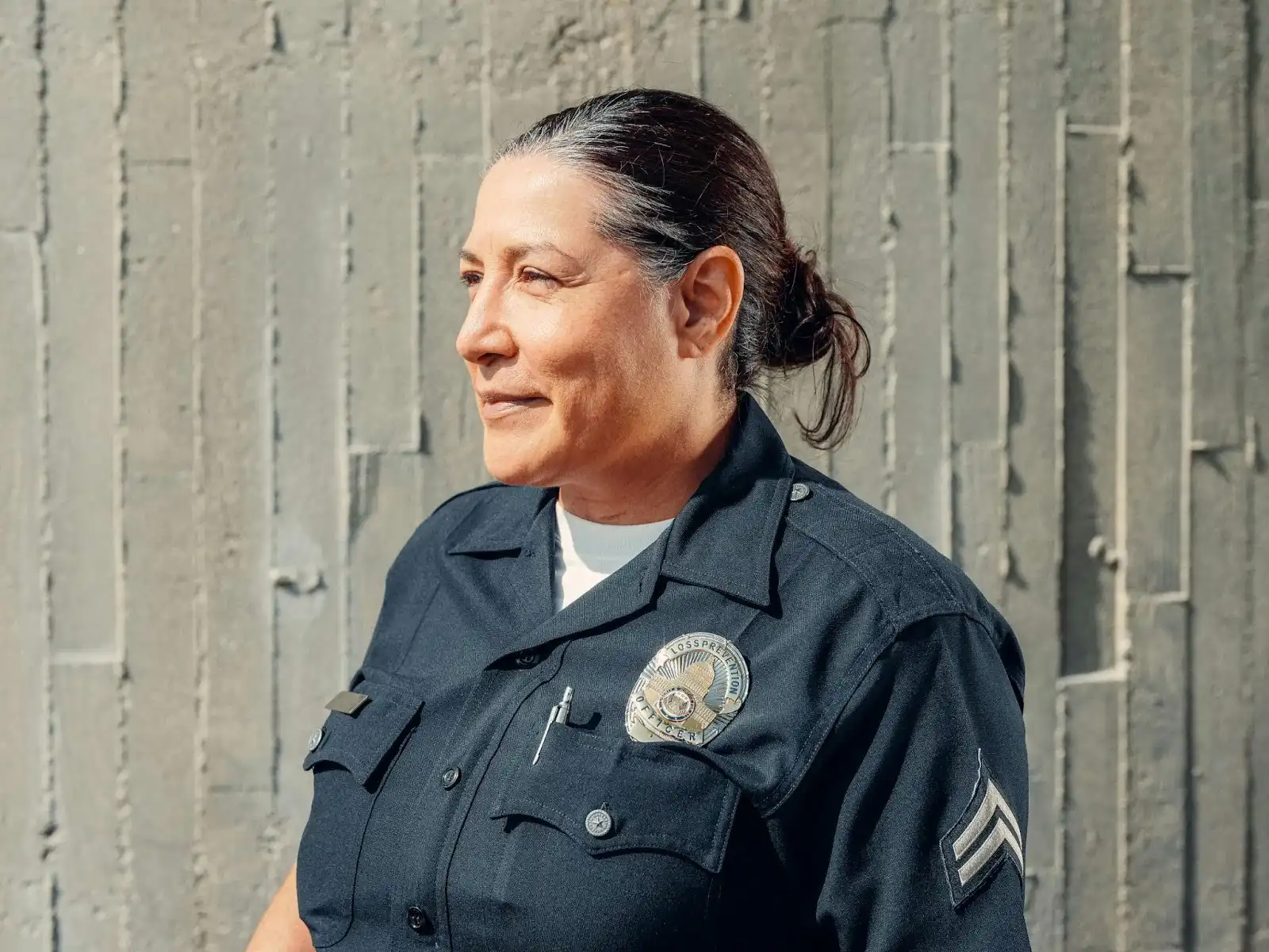 A female police officer smiling after Ketamine Therapy for Police Officers in Utah.