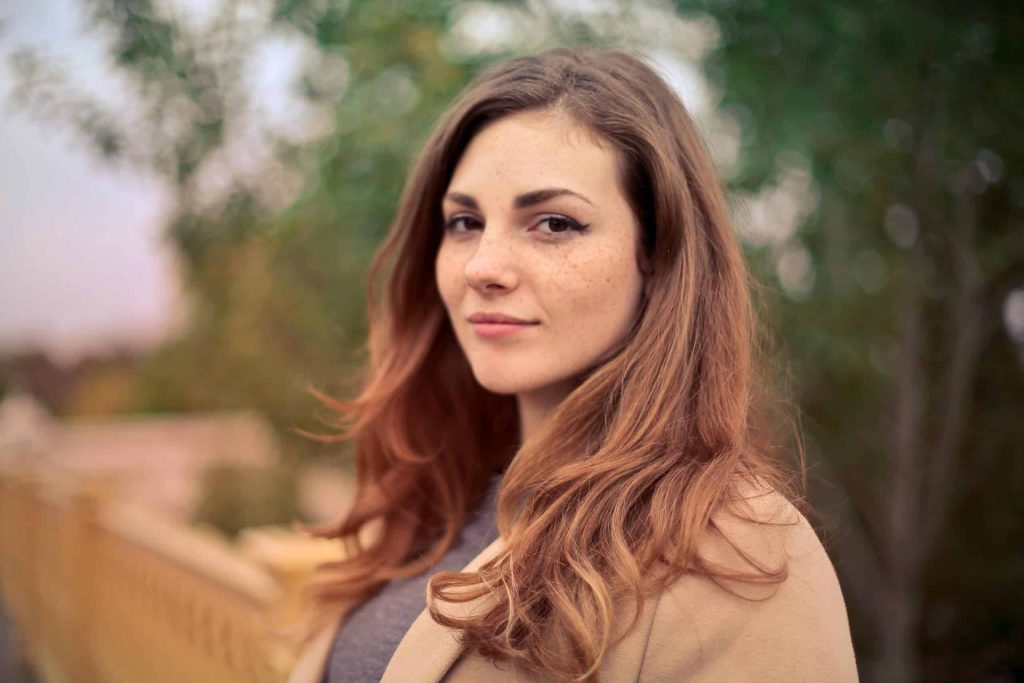 Woman smiling after ketamine for tourette's treatment.