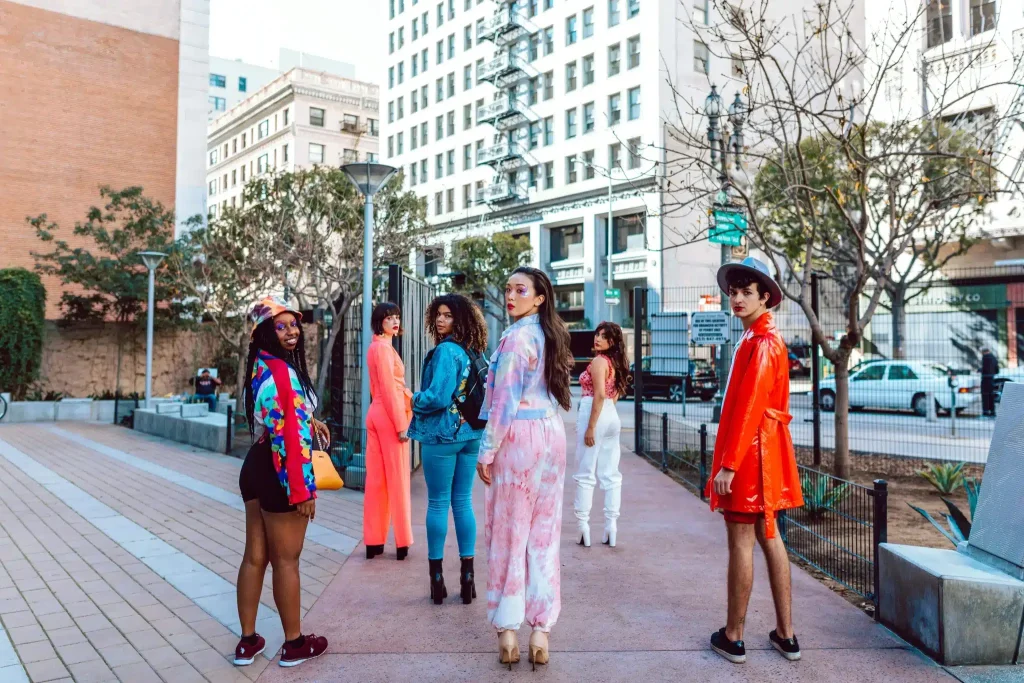 A diverse group of stylish individuals confidently pose after ketamine for transgender treatment.